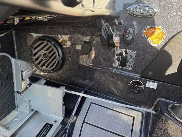 Slide: The Image of 2024 Bass Cat Puma STS boat interior with speaker and control panel. - 23