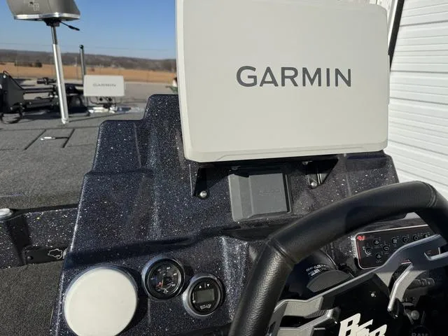 Slide: The Image of 2024 Bass Cat Puma STS dashboard with Garmin navigation system. - 24