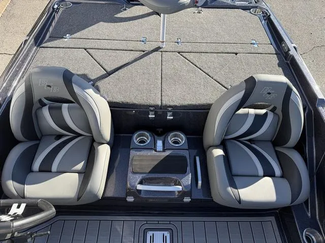 Slide: The Image of 2024 Bass Cat Puma STS boat interior with dual seats and center console. - 27