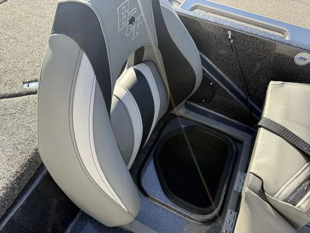 Slide: The Image of 2024 Bass Cat Puma STS boat seat with storage compartment, featuring sleek gray and black design. - 30