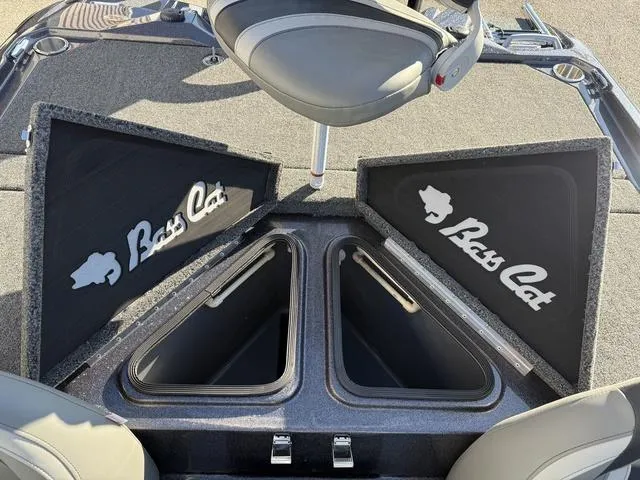 Slide: The Image of 2024 Bass Cat Puma STS boat storage compartments with logo, open view. - 32