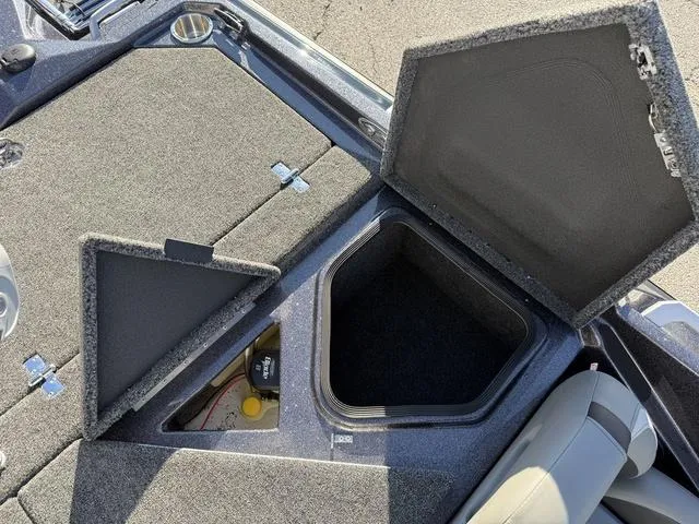 Slide: The Image of 2024 Bass Cat Puma STS boat storage compartments with open lids. - 33