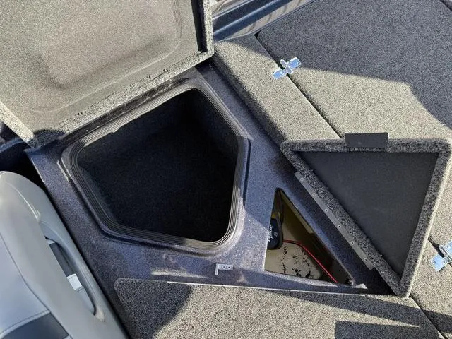 Slide: The Image of 2024 Bass Cat Puma STS boat storage compartments with open lids. - 34