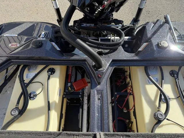 Slide: The Image of 2024 Bass Cat Puma STS boat engine compartment with fuel tanks and wiring. - 35