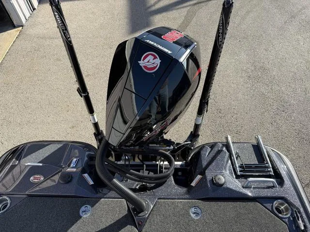 Slide: The Image of 2024 Bass Cat Puma STS boat with Mercury engine, rear view. - 37