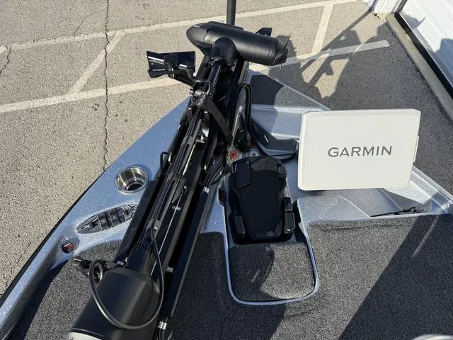 Slide: The Image of 2024 Bass Cat Puma STS boat deck with trolling motor and carpeted surface. - 8