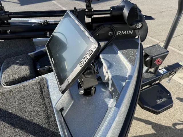 Slide: The Image of 2024 Bass Cat Puma STS boat interior with seating and Garmin equipment. - 9