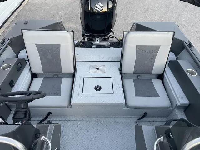 Slide: The Image of 2024 SeaArk Easy 200 boat interior with dual seats and steering console. - 10