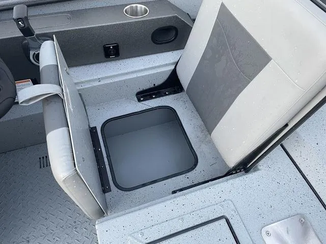 Slide: The Image of 2024 SeaArk Easy 200 boat seat with storage compartment open. - 11