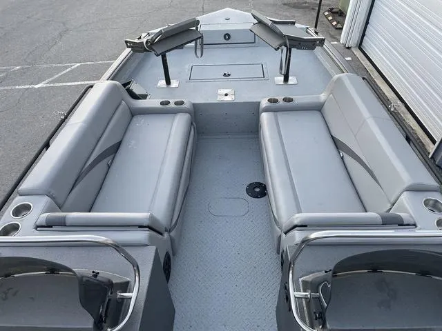 Slide: The Image of 2024 SeaArk Easy 200 boat interior with gray seating and spacious layout. - 15