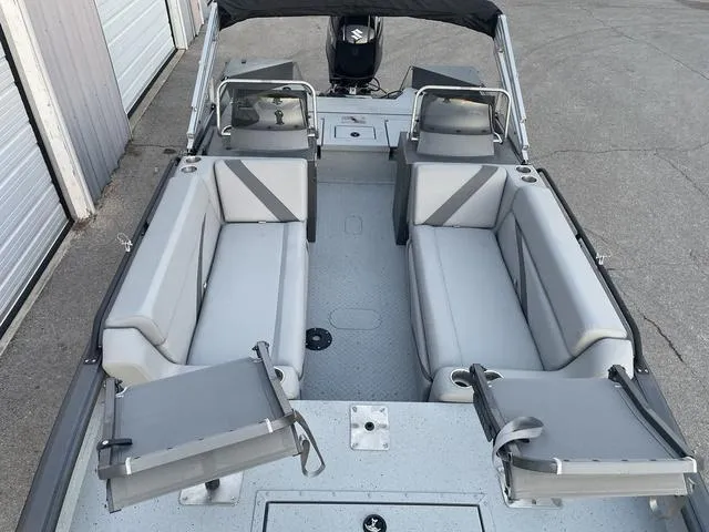 Slide: The Image of 2024 SeaArk Easy 200 boat interior with gray seating and open layout. - 6