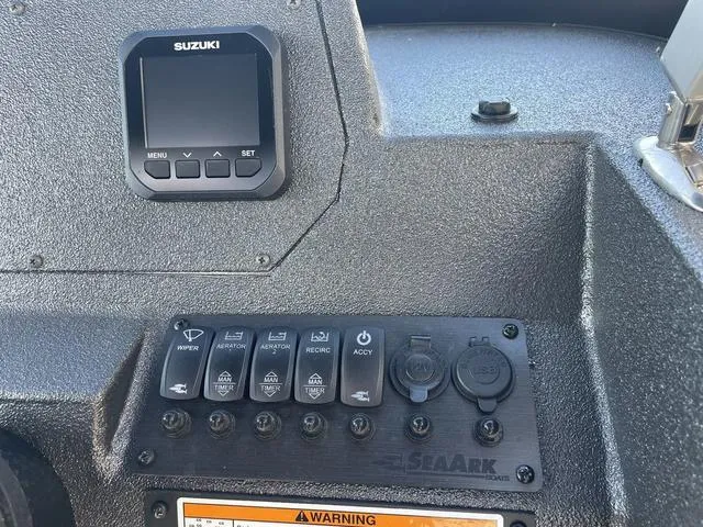 Slide: The Image of Control panel of 2025 SeaArk Pro Cat 240 boat with Suzuki display. - 13