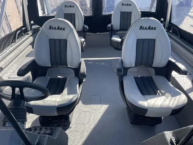 Slide: The Image of 2025 SeaArk Pro Cat 240 interior with four cushioned seats. - 15
