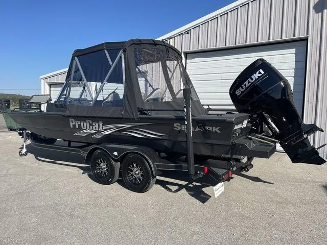 Slide: The Image of 2025 SeaArk Pro Cat 240 boat with Suzuki outboard motor, parked on a trailer. - 2