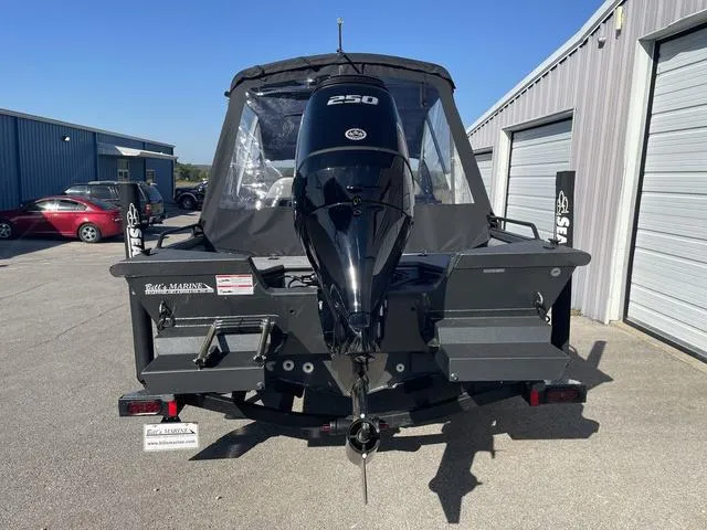 Slide: The Image of 2025 SeaArk Pro Cat 240 boat with powerful 250 HP engine, parked outdoors. - 3