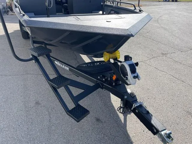 Slide: The Image of 2025 SeaArk Pro Cat 240 boat on trailer, featuring sturdy steps and hitch. - 4