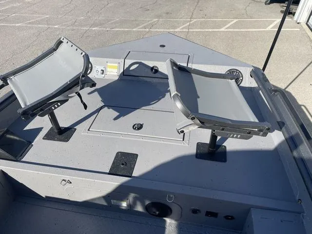 Slide: The Image of 2025 SeaArk Pro Cat 240 boat with two swivel seats on deck. - 6