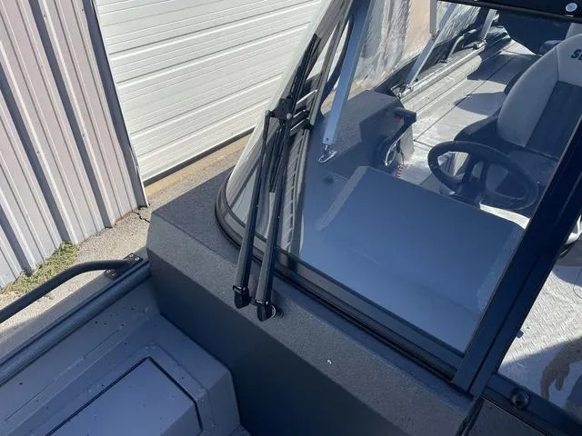 Slide: The Image of 2025 SeaArk Pro Cat 240 boat windshield and interior view. - 9