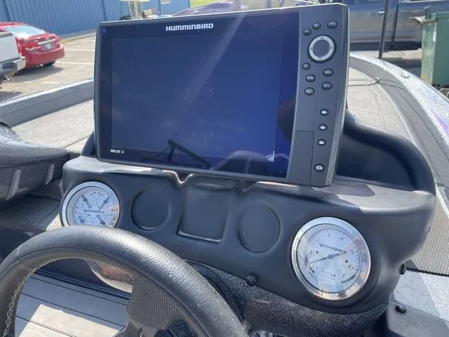 Slide: The Image of 2022 Phoenix 919 Pro XP dashboard with Humminbird Helix 10 fishfinder and gauges. - 22