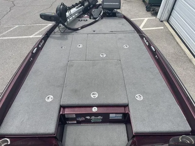 Slide: The Image of 2020 Bass Cat Cougar FTD boat deck with storage compartments and fishing equipment. - 10