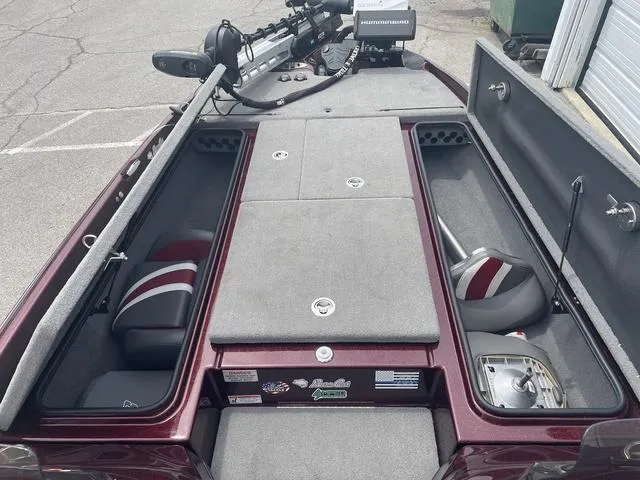Slide: The Image of 2020 Bass Cat Cougar FTD boat interior with storage compartments and seating. - 11