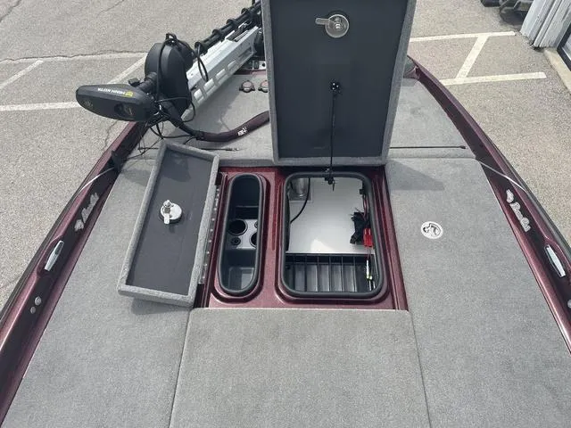 Slide: The Image of 2020 Bass Cat Cougar FTD boat deck with storage compartments and trolling motor. - 12