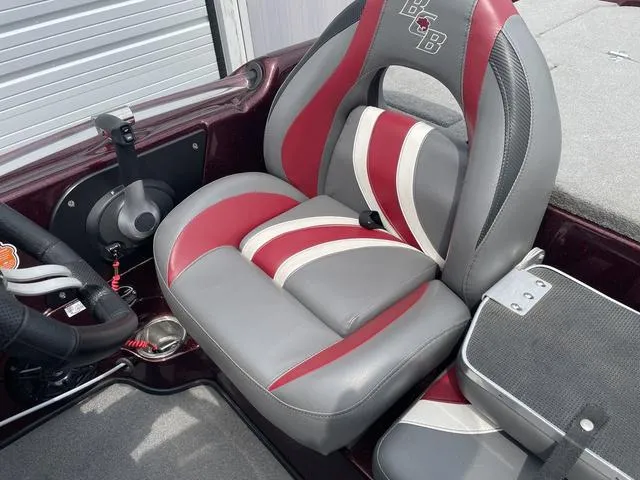 Slide: The Image of 2020 Bass Cat Cougar FTD boat seat with red and gray upholstery. - 17
