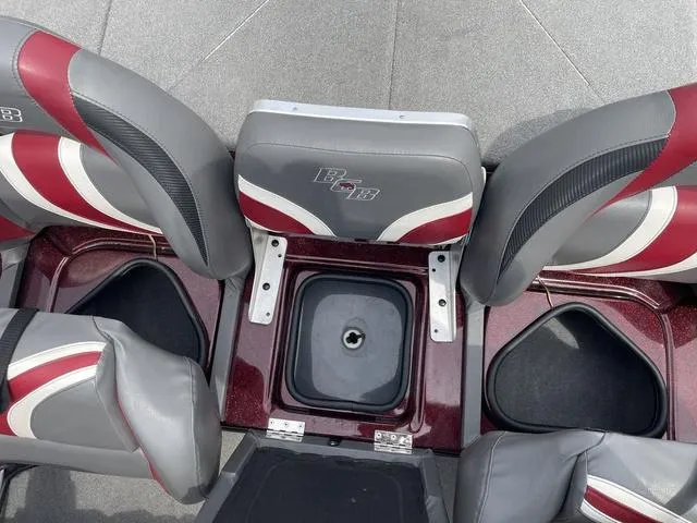 Slide: The Image of 2020 Bass Cat Cougar FTD boat seats with storage compartments, gray and red design. - 19
