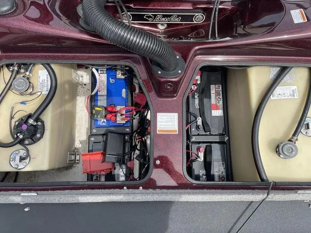 Slide: The Image of 2020 Bass Cat Cougar FTD boat battery compartment with wiring and components. - 24
