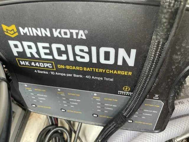 Slide: The Image of Minn Kota Precision MK 440PC on-board battery charger in Bass Cat Cougar FTD 2020. - 25