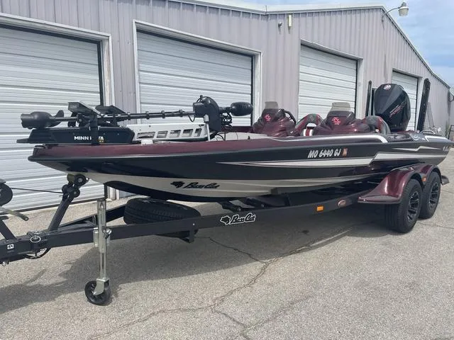 Slide: The Image of 2020 Bass Cat Cougar FTD boat on trailer near storage units. - 3