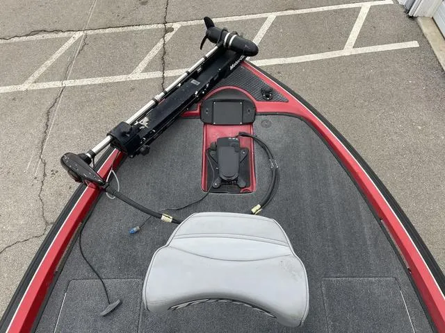 Slide: The Image of 2007 Triton 21 X2 boat deck with trolling motor and seat. - 11