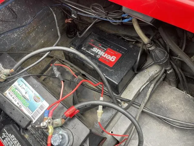 Slide: The Image of 2007 Triton 21 X2 boat battery compartment with wiring and connections. - 23