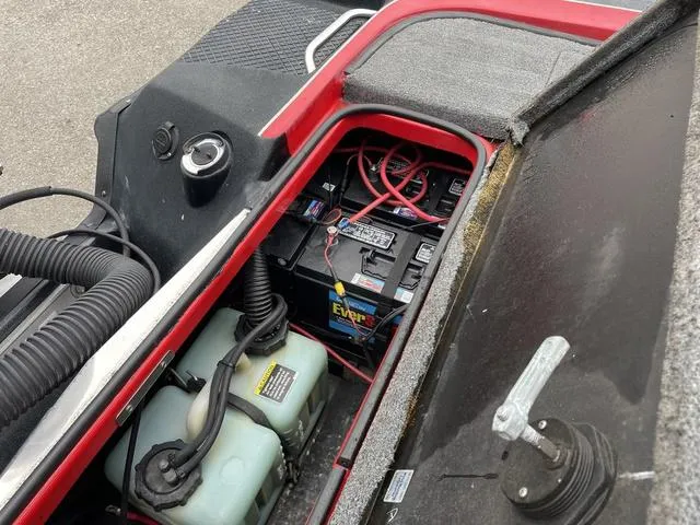 Slide: The Image of 2007 Triton 21 X2 boat battery compartment with wiring and components. - 25