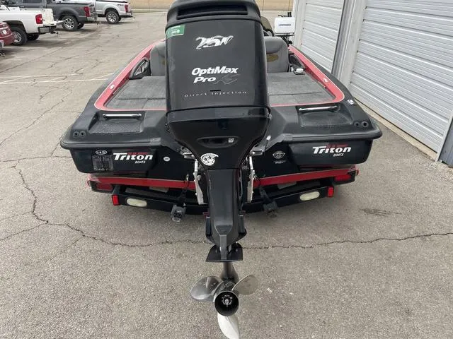 Slide: The Image of 2007 Triton 21 X2 boat with OptiMax Pro engine in parking lot. - 4