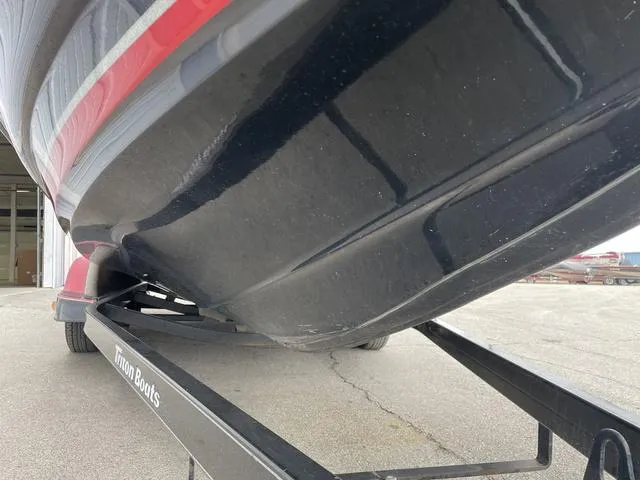Slide: The Image of 2007 Triton 21 X2 boat on trailer, close-up view of hull and trailer. - 7