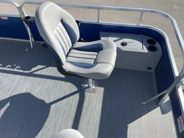 Slide: The Image of 2023 Lowe Ultra 182 Fish & Cruise boat interior with gray seating and storage. - 10