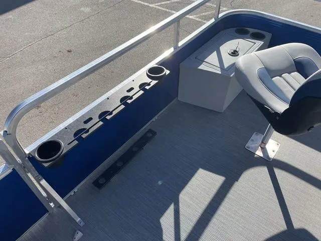 Slide: The Image of 2023 Lowe Ultra 182 Fish & Cruise boat interior with seating and rod holders. - 11