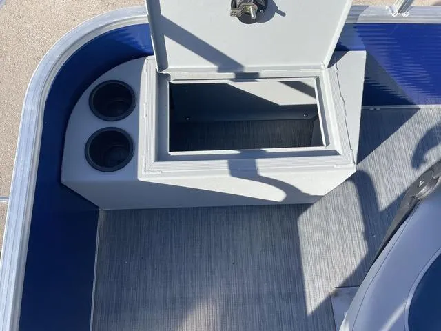 Slide: The Image of 2023 Lowe Ultra 182 Fish & Cruise boat storage compartment with cup holders. - 13