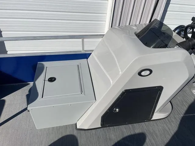 Slide: The Image of 2023 Lowe Ultra 182 Fish & Cruise boat console and storage compartment. - 14