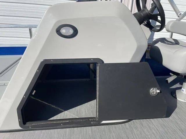 Slide: The Image of 2023 Lowe Ultra 182 Fish & Cruise boat console with open storage compartment. - 16