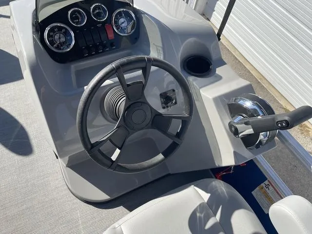 Slide: The Image of 2023 Lowe Ultra 182 Fish & Cruise boat dashboard with steering wheel and controls. - 17