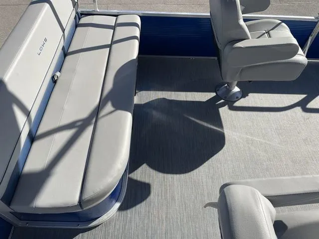 Slide: The Image of 2023 Lowe Ultra 182 Fish & Cruise boat interior with gray seating and flooring. - 21