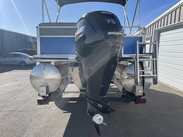 Slide: The Image of 2023 Lowe Ultra 182 Fish & Cruise boat with Mercury 75 engine, parked outdoors. - 3