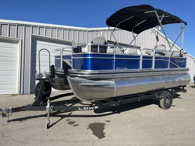 Slide: The Image of 2023 Lowe Ultra 182 Fish & Cruise pontoon boat with canopy on trailer. - 5