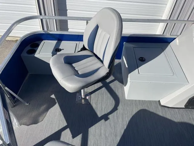 Slide: The Image of 2023 Lowe Ultra 182 Fish & Cruise boat interior with seating and storage compartments. - 9