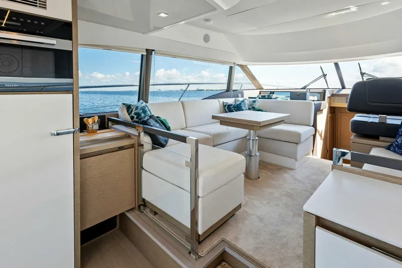 Slide: The Image of Luxurious interior of 2023 Prestige 460 Flybridge yacht with elegant seating and ocean view. - 10