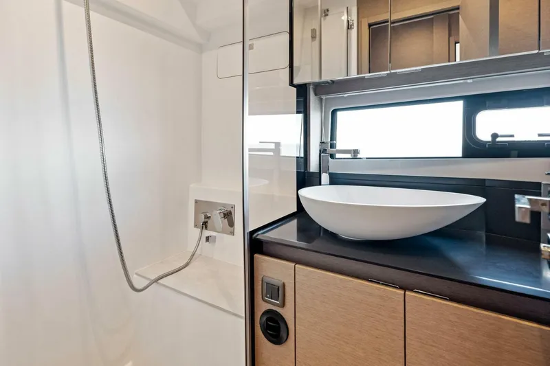 Slide: The Image of Modern bathroom in 2023 Prestige 460 Flybridge yacht with sleek sink and shower. - 31