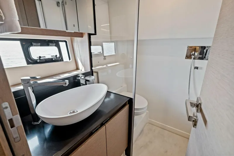 Slide: The Image of Luxurious bathroom in 2023 Prestige 460 Flybridge yacht with modern fixtures and sleek design. - 39