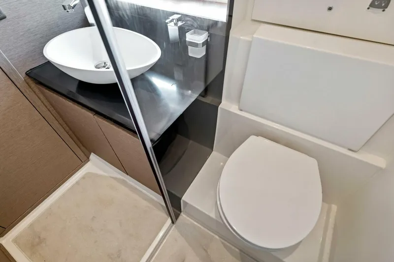 Slide: The Image of Modern bathroom in 2023 Prestige 460 Flybridge yacht with sleek sink and toilet. - 40